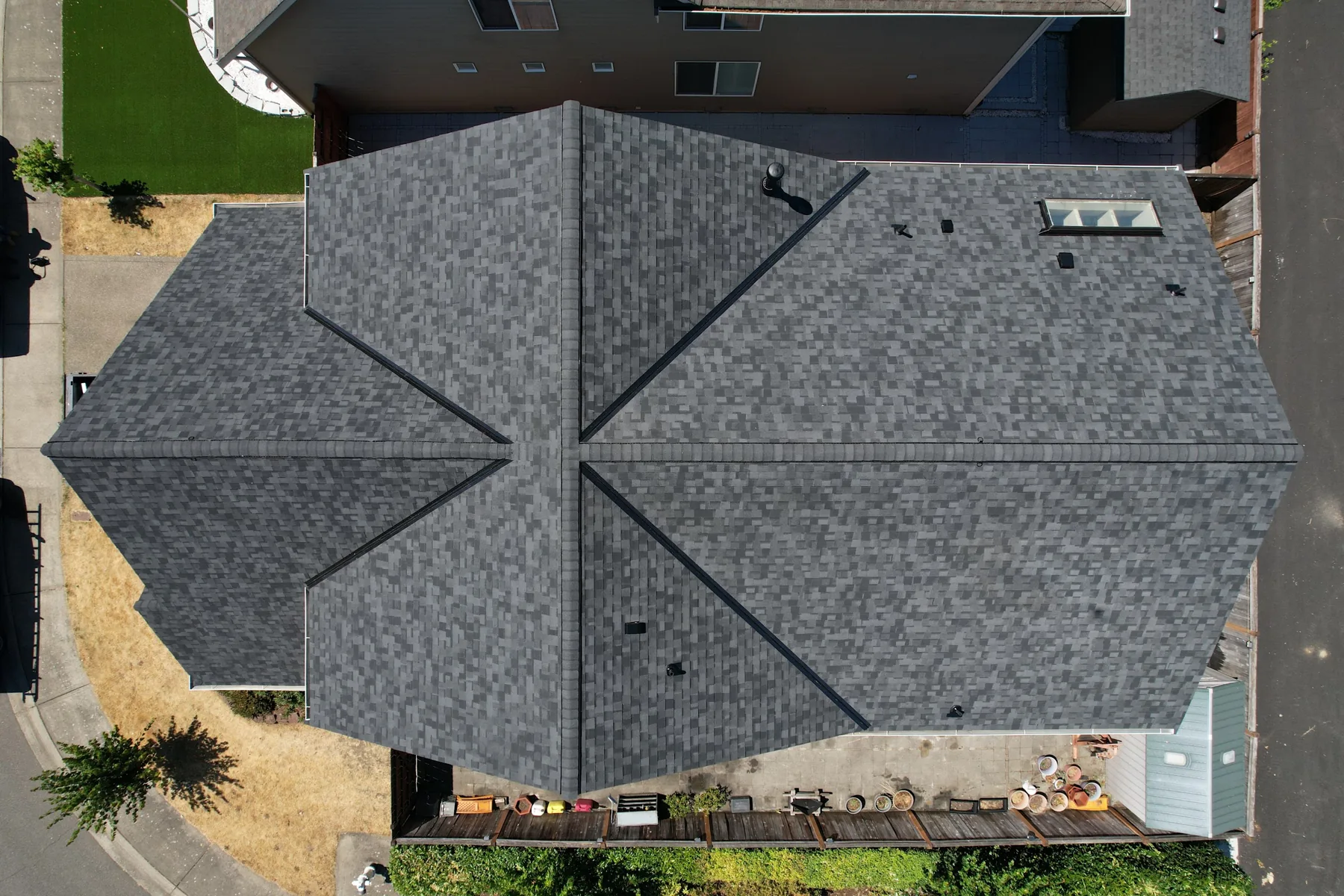 The same roof after Titan Roofing's full replacement with new architectural shingles