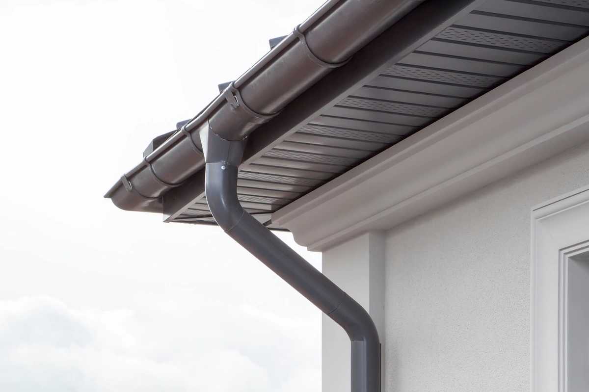 Seamless metal gutters and downspout installed on a home