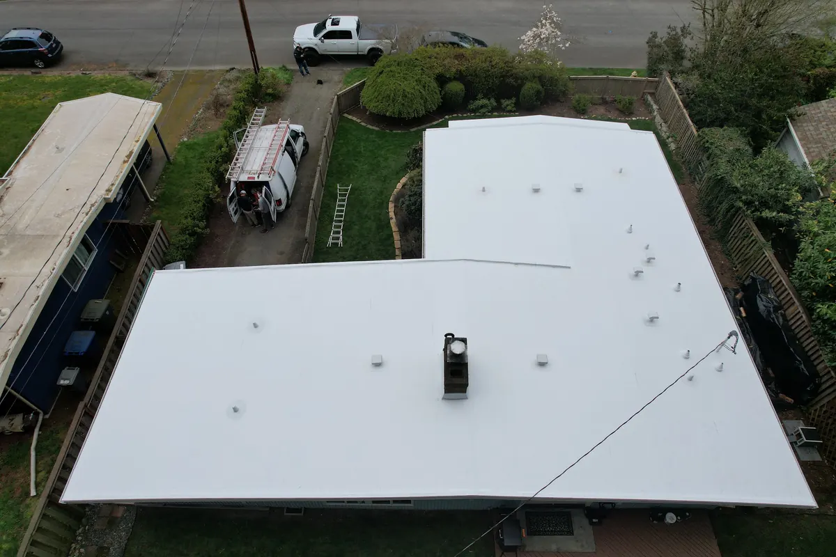 After: Flat roof to white TPO membrane