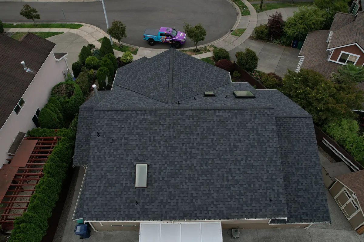 After: Brown shingles to a charcoal architectural roof