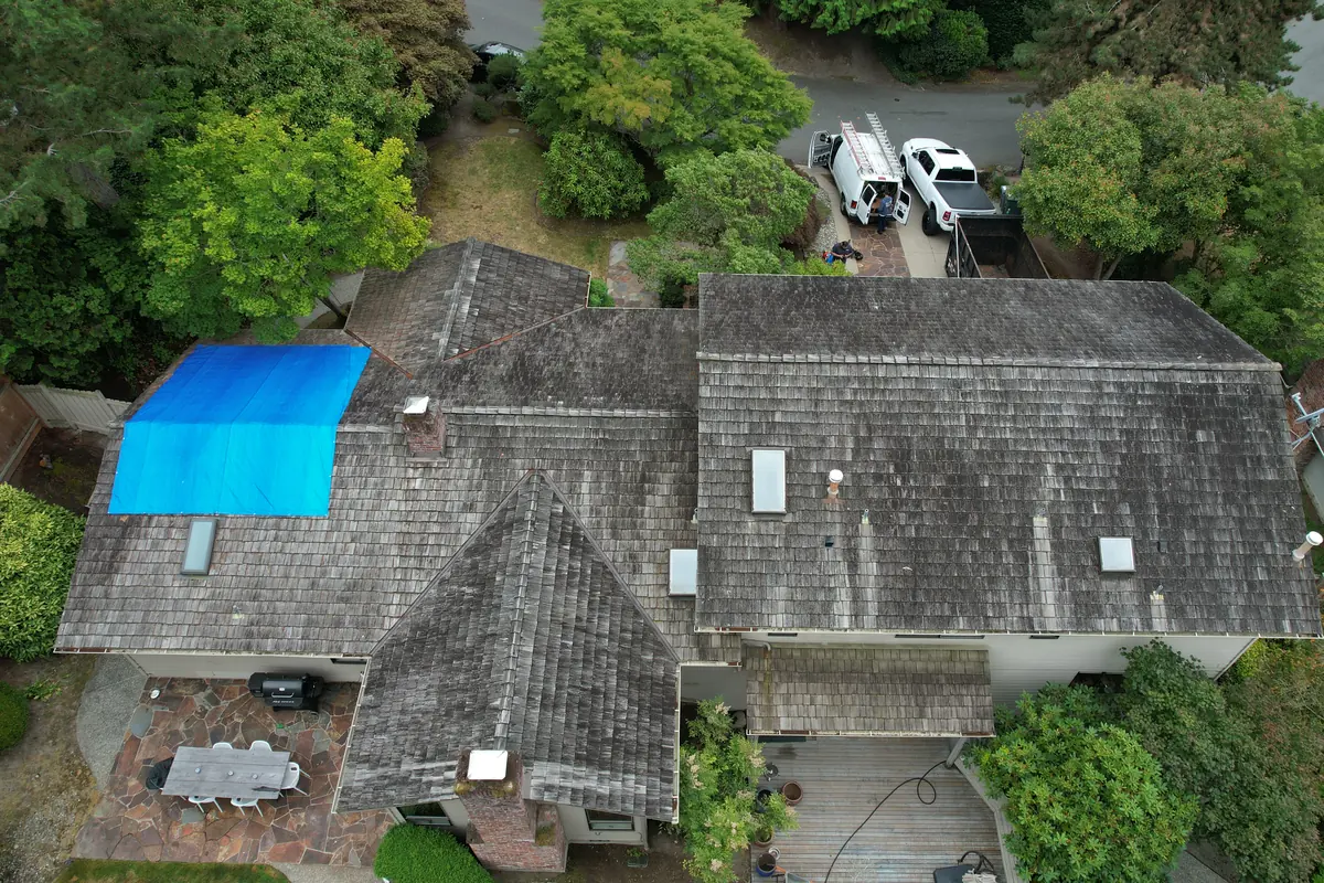 Before: Tarped cedar shakes to architectural shingles
