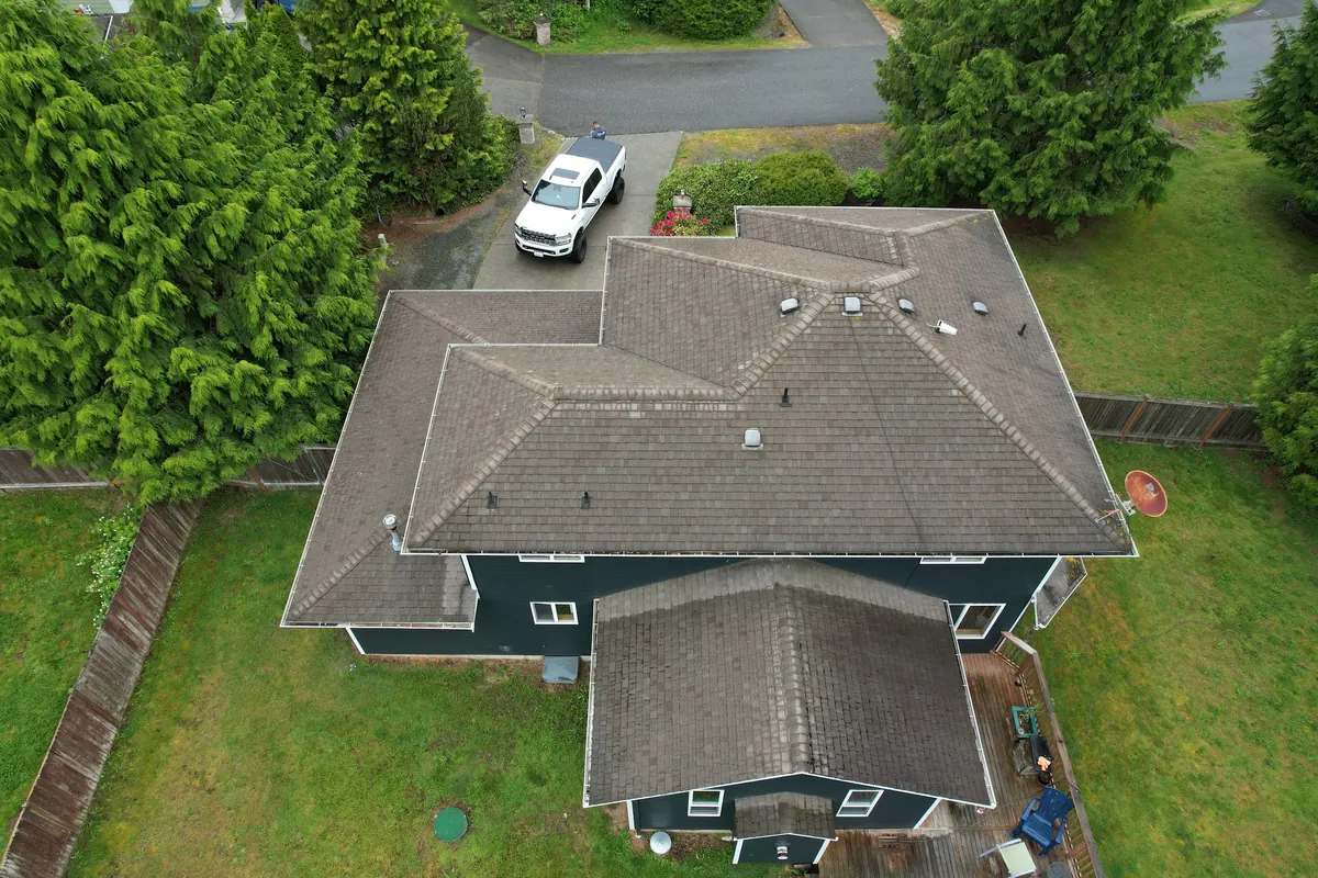 Before: Moss-covered roof to a new roof