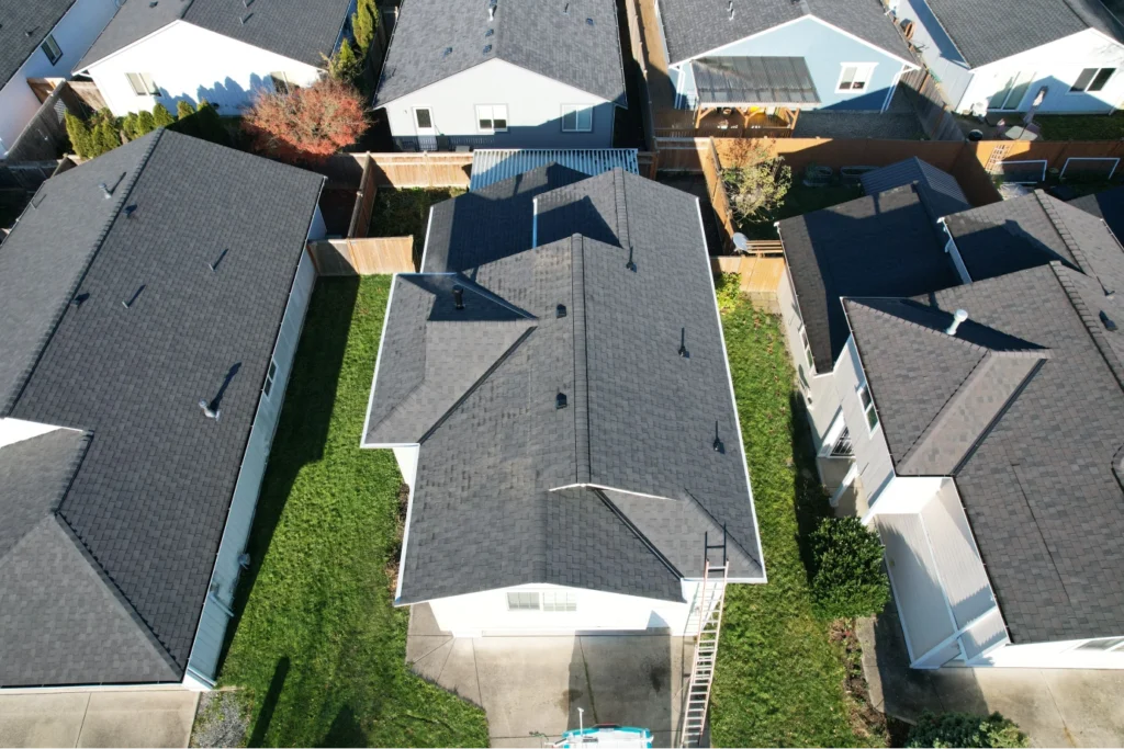 Aerial drone view of a residential roofing project by The Roofing Titan