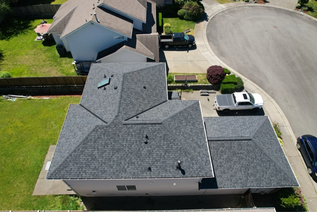 Aerial drone view of a completed roof replacement by The Roofing Titan